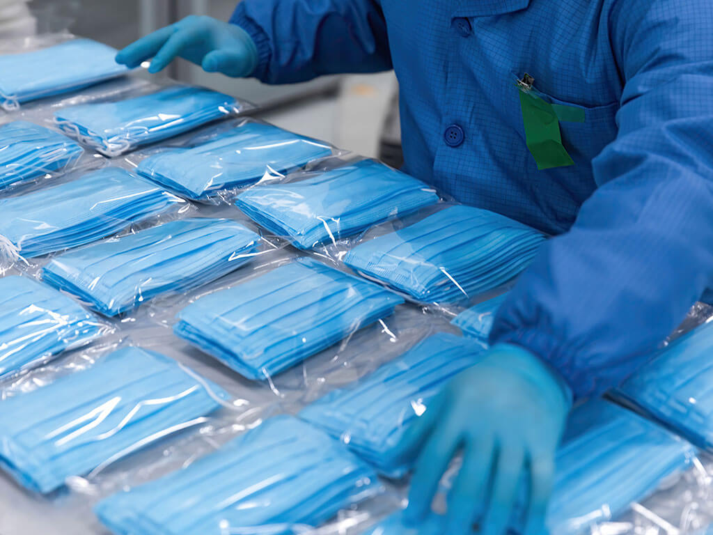 Worker over seeing packaged medical masks